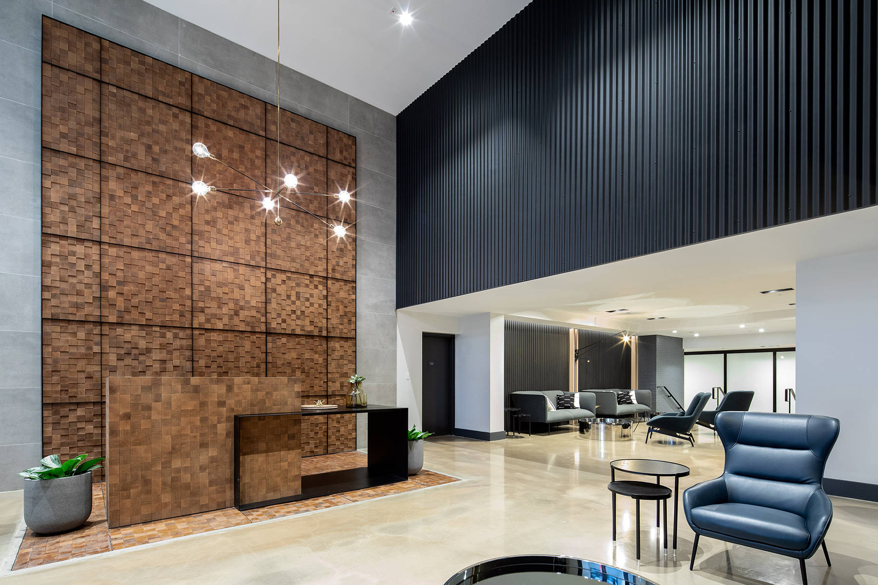 The Strand Large Modern Entrance and Lobby with high ceilings, check in table and seating